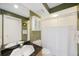 Bathroom featuring a built-in cabinet, granite vanity, and shower/tub combo at 816 Ponce De Leon Dr, Tierra Verde, FL 33715