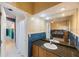 Bright bathroom with dual sink granite vanity and adjacent bedroom with twin bed at 816 Ponce De Leon Dr, Tierra Verde, FL 33715