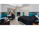 Bedroom featuring blue accent walls, ample closet space, natural light, and access to the lanai at 816 Ponce De Leon Dr, Tierra Verde, FL 33715