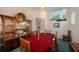 Formal dining room showcasing a large table, china cabinet, and stylish decor at 816 Ponce De Leon Dr, Tierra Verde, FL 33715