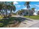 Stunning waterfront home boasting mature palms, a circular drive, and charming curb appeal at 816 Ponce De Leon Dr, Tierra Verde, FL 33715