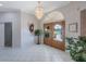 Elegant foyer with soaring ceilings, chandelier, and decorative double doors at 816 Ponce De Leon Dr, Tierra Verde, FL 33715