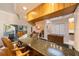 Open kitchen featuring bar seating, granite countertops, and stainless steel appliances at 816 Ponce De Leon Dr, Tierra Verde, FL 33715