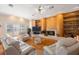Open living room boasting hardwood floors, bright windows, a fireplace, and built-in shelving at 816 Ponce De Leon Dr, Tierra Verde, FL 33715
