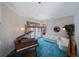 Spacious living room with a piano, plush sofa, and ample natural light at 816 Ponce De Leon Dr, Tierra Verde, FL 33715