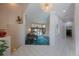 Bright, airy living room featuring a grand piano and comfortable seating at 816 Ponce De Leon Dr, Tierra Verde, FL 33715