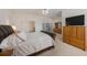 Well-lit main bedroom featuring a big bed, storage and an ensuite bathroom at 816 Ponce De Leon Dr, Tierra Verde, FL 33715