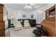 Bright office with classic furniture, neutral walls, and two off-white armchairs at 816 Ponce De Leon Dr, Tierra Verde, FL 33715