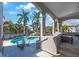 Backyard pool and spa with patio furniture and tropical landscaping at 816 Ponce De Leon Dr, Tierra Verde, FL 33715
