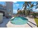 Relaxing pool with inviting jacuzzi, surrounded by lounge chairs and palm trees, perfect for outdoor enjoyment at 816 Ponce De Leon Dr, Tierra Verde, FL 33715