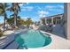 Beautiful pool and patio area with tropical landscaping and serene outdoor space at 816 Ponce De Leon Dr, Tierra Verde, FL 33715