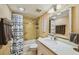 Cozy bathroom with a tub, shower, and a vanity with a white countertop at 8635 Midnight Pass Rd # 307C, Sarasota, FL 34242