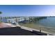 Scenic view of the community dock on a sunny day at 8635 Midnight Pass Rd # 307C, Sarasota, FL 34242