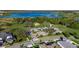 Stunning aerial view of community amenities, green space, parking, and access to large lake and conservation areas at 9748 Ibis Grove Blvd, Wesley Chapel, FL 33545