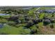 Panoramic aerial view highlighting community green spaces, walking paths, waterways, and natural conservation areas at 9748 Ibis Grove Blvd, Wesley Chapel, FL 33545