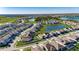 Aerial view of a neighborhood with lakes and houses, showcasing a community's layout and setting at 9748 Ibis Grove Blvd, Wesley Chapel, FL 33545