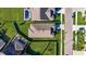 An aerial shot shows property lines highlighting location with manicured lawns in a residential neighborhood at 9748 Ibis Grove Blvd, Wesley Chapel, FL 33545
