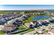 Enjoy an aerial view of this beautiful, single-Gathering home nestled within a vibrant community, perfect for families and lake enthusiasts at 9748 Ibis Grove Blvd, Wesley Chapel, FL 33545