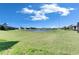 Expansive backyard with picturesque pond views perfect for outdoor relaxation and enjoyment at 9748 Ibis Grove Blvd, Wesley Chapel, FL 33545
