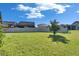 Spacious backyard offering ample green space and privacy for outdoor activities and recreation at 9748 Ibis Grove Blvd, Wesley Chapel, FL 33545