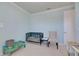 Inviting Bedroom with a crib, chair, and playful decor, offering a cozy and comforting atmosphere at 9748 Ibis Grove Blvd, Wesley Chapel, FL 33545