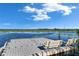 A tranquil waterfront escape on the community dock features benches for serene lake views and relaxation at 9748 Ibis Grove Blvd, Wesley Chapel, FL 33545