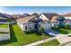 Well maintained gray single Gathering home with beautiful landscaping and a two-car garage at 9748 Ibis Grove Blvd, Wesley Chapel, FL 33545