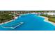 The lagoon offers a beach-like setting with sandy shorelines, water activities, and a vibrant community atmosphere for endless recreation at 9748 Ibis Grove Blvd, Wesley Chapel, FL 33545