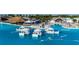 Stunning turquoise lagoon featuring floating cabanas and a tiki bar for leisure and relaxation at 9748 Ibis Grove Blvd, Wesley Chapel, FL 33545