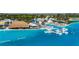 Stunning turquoise lagoon featuring floating cabanas and a tiki bar for leisure and relaxation at 9748 Ibis Grove Blvd, Wesley Chapel, FL 33545