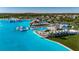 Beautiful aerial view of the lagoon-style pool with slides, lounging, dining and recreational areas at 9748 Ibis Grove Blvd, Wesley Chapel, FL 33545