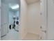 Functional laundry room with tiled floor and a washing machine, providing ample space and convenience at 9748 Ibis Grove Blvd, Wesley Chapel, FL 33545