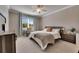 Sunlit main bedroom features a dedicated work space with a large window at 9748 Ibis Grove Blvd, Wesley Chapel, FL 33545