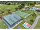 Aerial of rec area with racquetball, playground, basketball, volleyball, and parking for Gathering fun at 10306 Green Grove Pl, Tampa, FL 33624