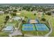 An aerial view of the community with tennis courts, recreational areas, pool, and sports facilities at 10306 Green Grove Pl, Tampa, FL 33624