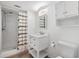 Bathroom featuring a walk-in shower, marble vanity, and modern fixtures at 10306 Green Grove Pl, Tampa, FL 33624