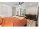 Comfortable bedroom boasts wood-look flooring, a ceiling fan, and a neutral color palette at 10306 Green Grove Pl, Tampa, FL 33624