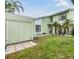 Two-story home features a well-manicured lawn, attached garage, and a walkway to the front door at 10306 Green Grove Pl, Tampa, FL 33624