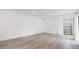 Bright and open living room showcasing natural light and new modern hard wood floors at 10306 Green Grove Pl, Tampa, FL 33624