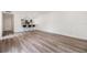 Open-concept living room showcasing stylish flooring, bar seating, and seamless flow to the adjacent kitchen at 10306 Green Grove Pl, Tampa, FL 33624