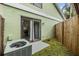 Sliding glass doors open to the cozy patio, perfect for outdoor entertaining with fenced yard at 10306 Green Grove Pl, Tampa, FL 33624