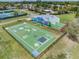 Aerial view of a community playground with colorful murals, games, and sports courts for active recreation at 10306 Green Grove Pl, Tampa, FL 33624