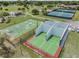 Aerial view of rec area with racquetball, playground, basketball, and parking for Gathering fun at 10306 Green Grove Pl, Tampa, FL 33624