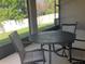 Covered patio with outdoor seating and view of backyard at 10434 Scenic Hollow Dr, Riverview, FL 33578