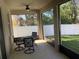 Covered patio with outdoor seating overlooking the backyard at 10434 Scenic Hollow Dr, Riverview, FL 33578