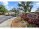 Attractive entrance sign to Lakeview Townhomes surrounded by landscaping and street views at 11047 Black Swan Ct, Seffner, FL 33584