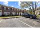 Townhome featuring designated parking, well-maintained lawn, and lovely landscaping at 11047 Black Swan Ct, Seffner, FL 33584