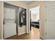 Laundry area with a stacked washer and dryer near the bedroom at 11047 Black Swan Ct, Seffner, FL 33584
