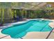 Inviting pool with attached spa and screened enclosure, perfect for outdoor relaxation at 11725 Derbyshire Dr, Tampa, FL 33626