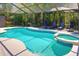 Inviting pool with attached spa and screened enclosure, perfect for outdoor relaxation at 11725 Derbyshire Dr, Tampa, FL 33626